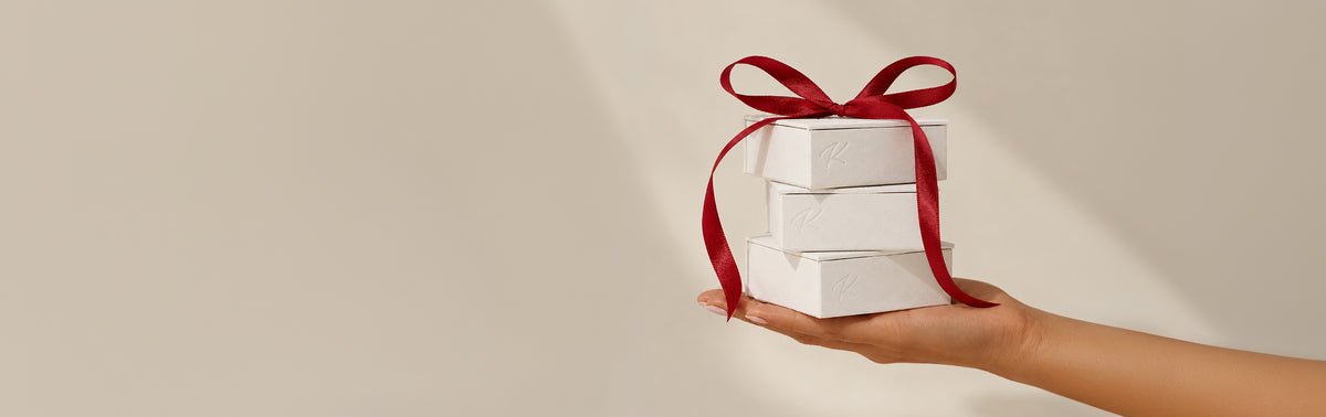 KOSINER jewelry gift boxes with a red ribbon