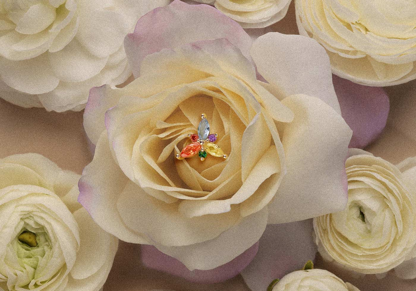 Multi-colored marquise gemstone cluster stud earring in gold set inside a flower for elegant cartilage or helix piercings.