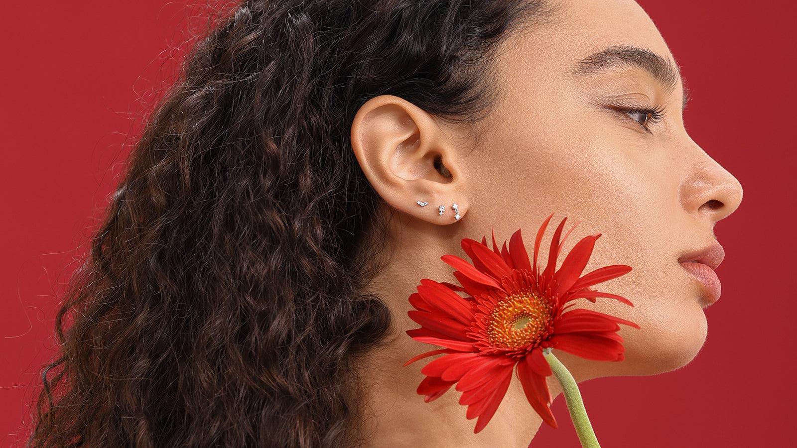 Professional model wearing delicate  silver piercing jewelry studs ideal for sensitive skin gifts