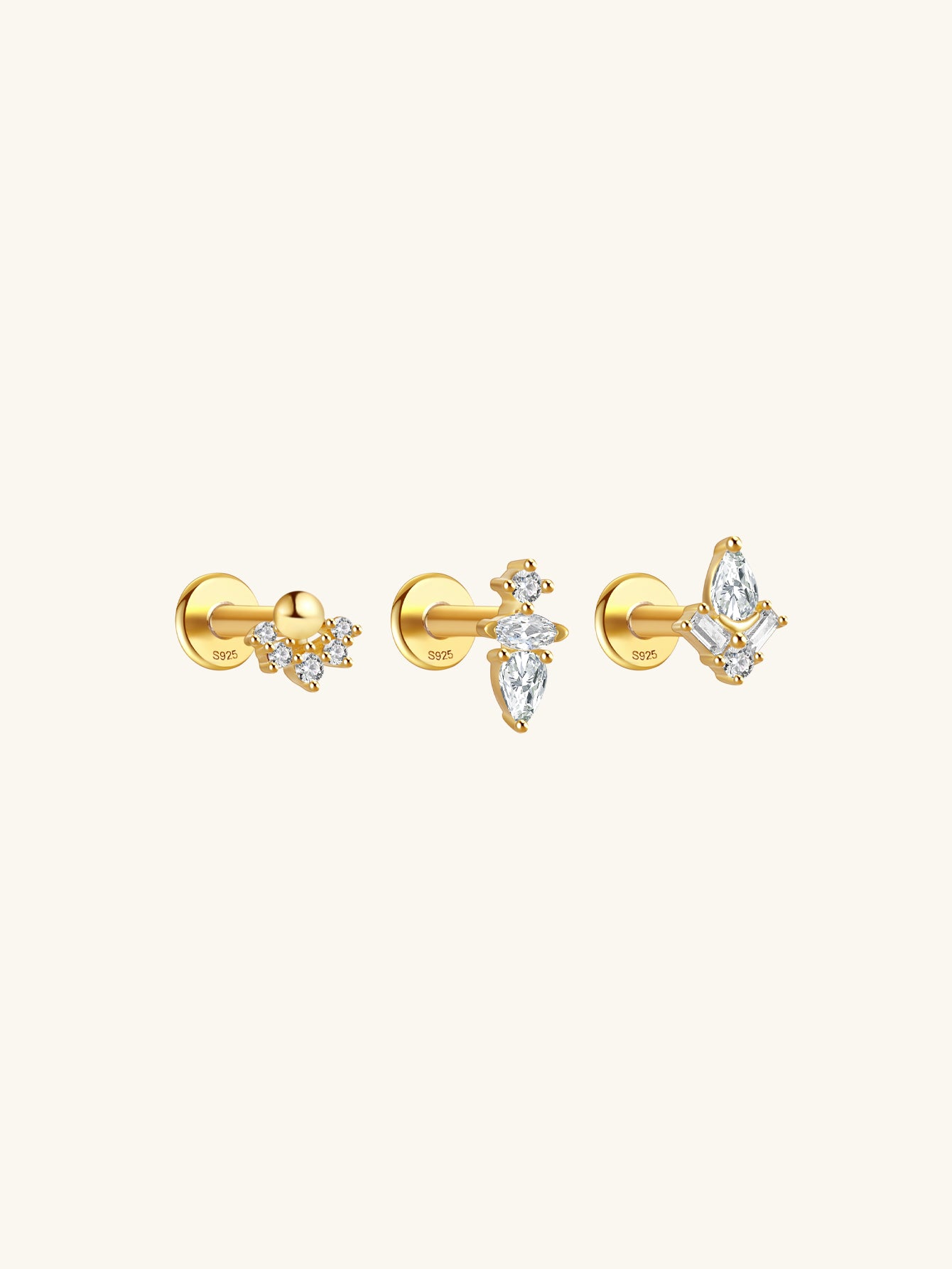 Three 18k gold plated sterling silver flat back labret studs with cubic zirconia: crown, marquise, butterfly.