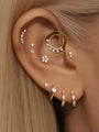 14K solid gold daith earring with sunburst cubic zirconia crystals. 18g, 8mm inner diameter.