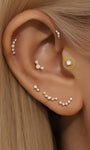 14K solid gold labret stud earring with sparkling AAAAA cubic zirconia on ear.