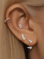 925 Sterling Silver Leaf Earrings with Cubic Zirconia on model's ear.