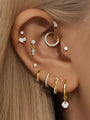 Gold plated 925 sterling silver earrings with cubic zirconia: hoops, studs, dangles on ear.