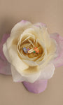 KOSINER 14K solid gold colorful baguette rainbow cluster flat back stud placed on pale gradient rose, vibrant multi cubic zirconia cartilage ear jewelry