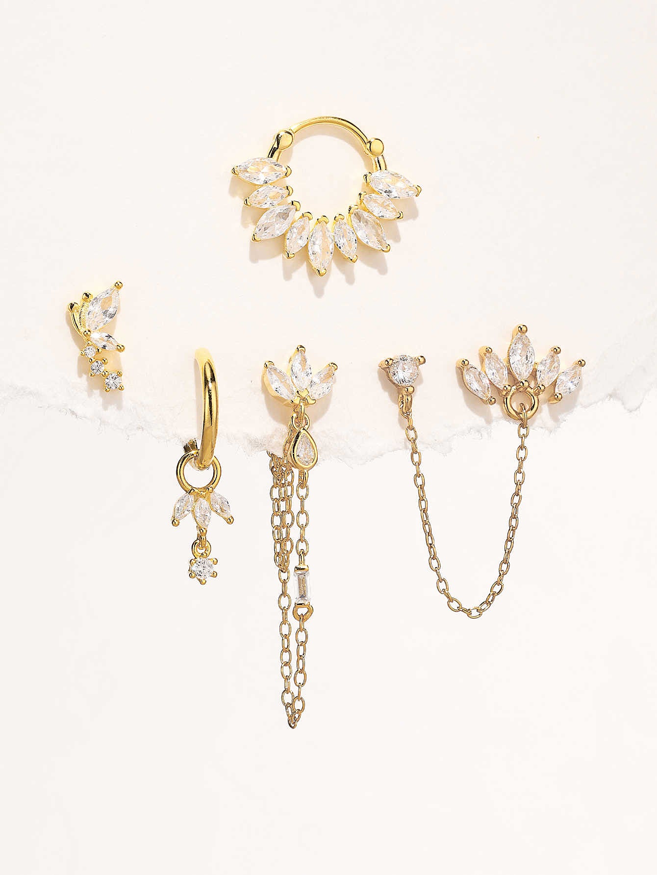 5-piece 18K gold plated sterling silver earring set featuring marquise-cut cubic zirconia in floral and celestial designs.