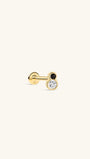 Side profile shot of KOSINER Puzzle 14K solid gold two-tone bezel flat back stud, internally threaded post stamped 14K, figure-8 shaped bezel setting with top black cz stone & larger clear round cz stone, modern black-white contrast cartilage piercing stud