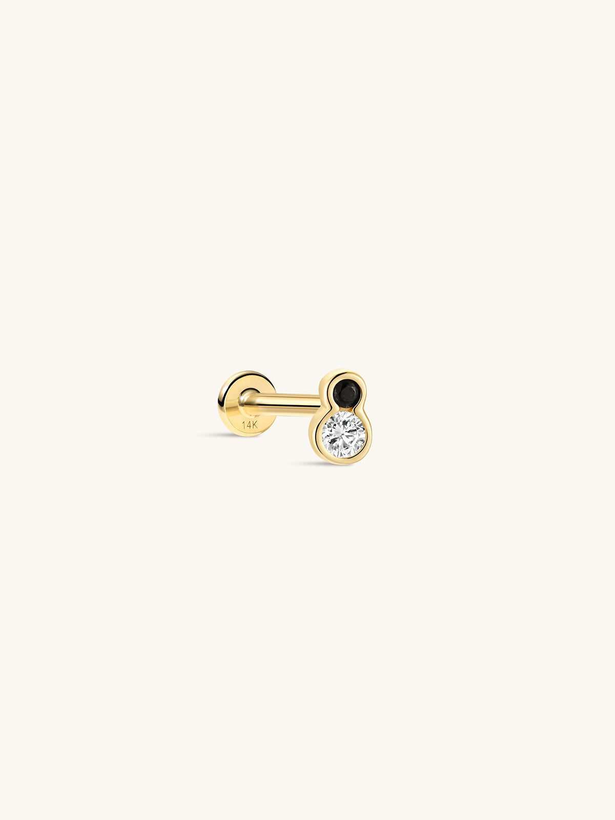 Side profile shot of KOSINER Puzzle 14K solid gold two-tone bezel flat back stud, internally threaded post stamped 14K, figure-8 shaped bezel setting with top black cz stone & larger clear round cz stone, modern black-white contrast cartilage piercing stud