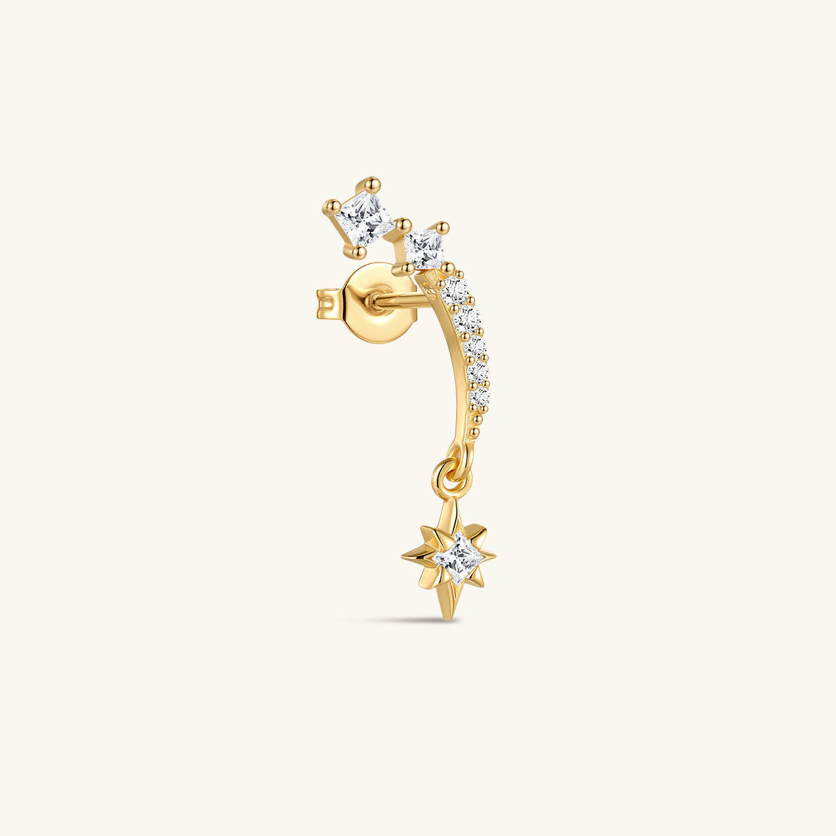 Angled view of KOSINER Rising Star gold-plated star earring showing clear stones, a dangling star and butterfly back