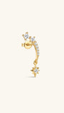Angled view of KOSINER Rising Star gold-plated star earring showing clear stones, a dangling star and butterfly back