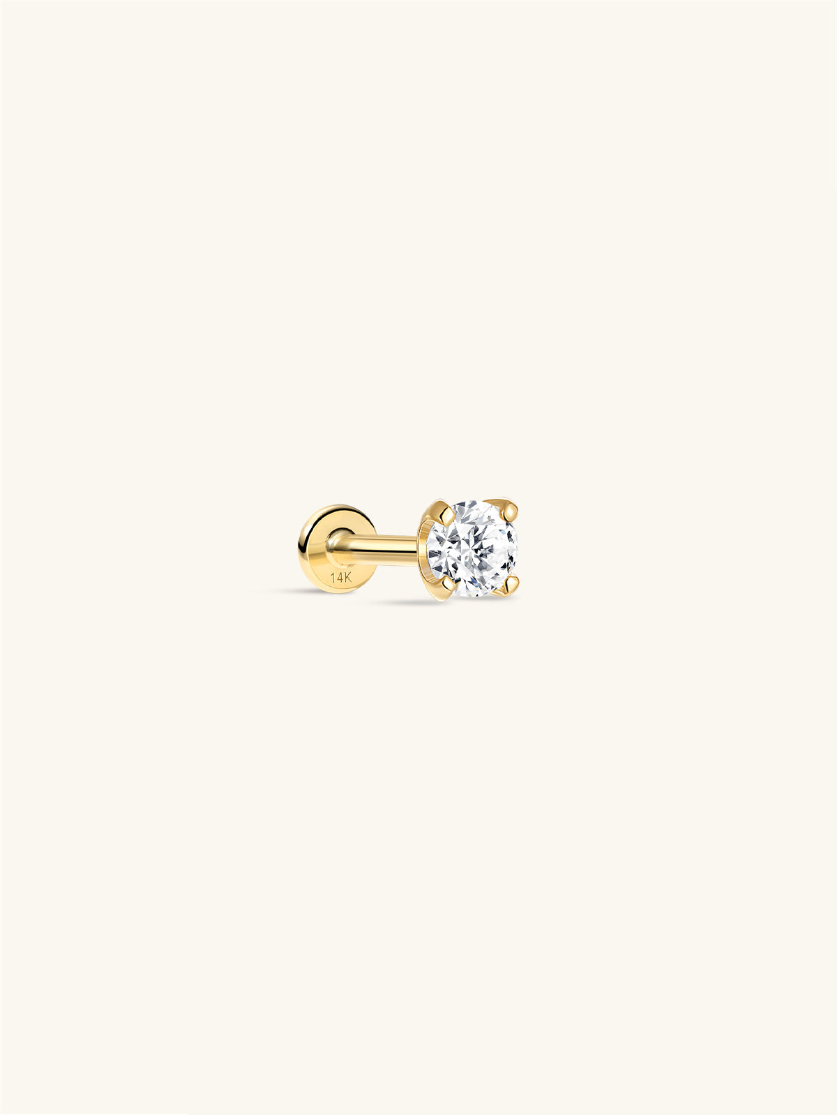 Single KOSINER 14K solid gold four-prong round moissanite flat back stud, internally threaded labret style with 14K marked round back plate, shot on off-white minimalist background