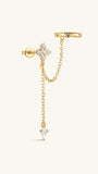 Close-up of KOSINER Rising Star left-ear chain earring connecting a star and moon stud to an ear cuff