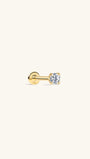 Single KOSINER 14K solid gold flat back piercing stud, four-prong setting holding round lab-grown diamond, internally threaded labret design with 14K stamped flat back base, shot on plain off-white background