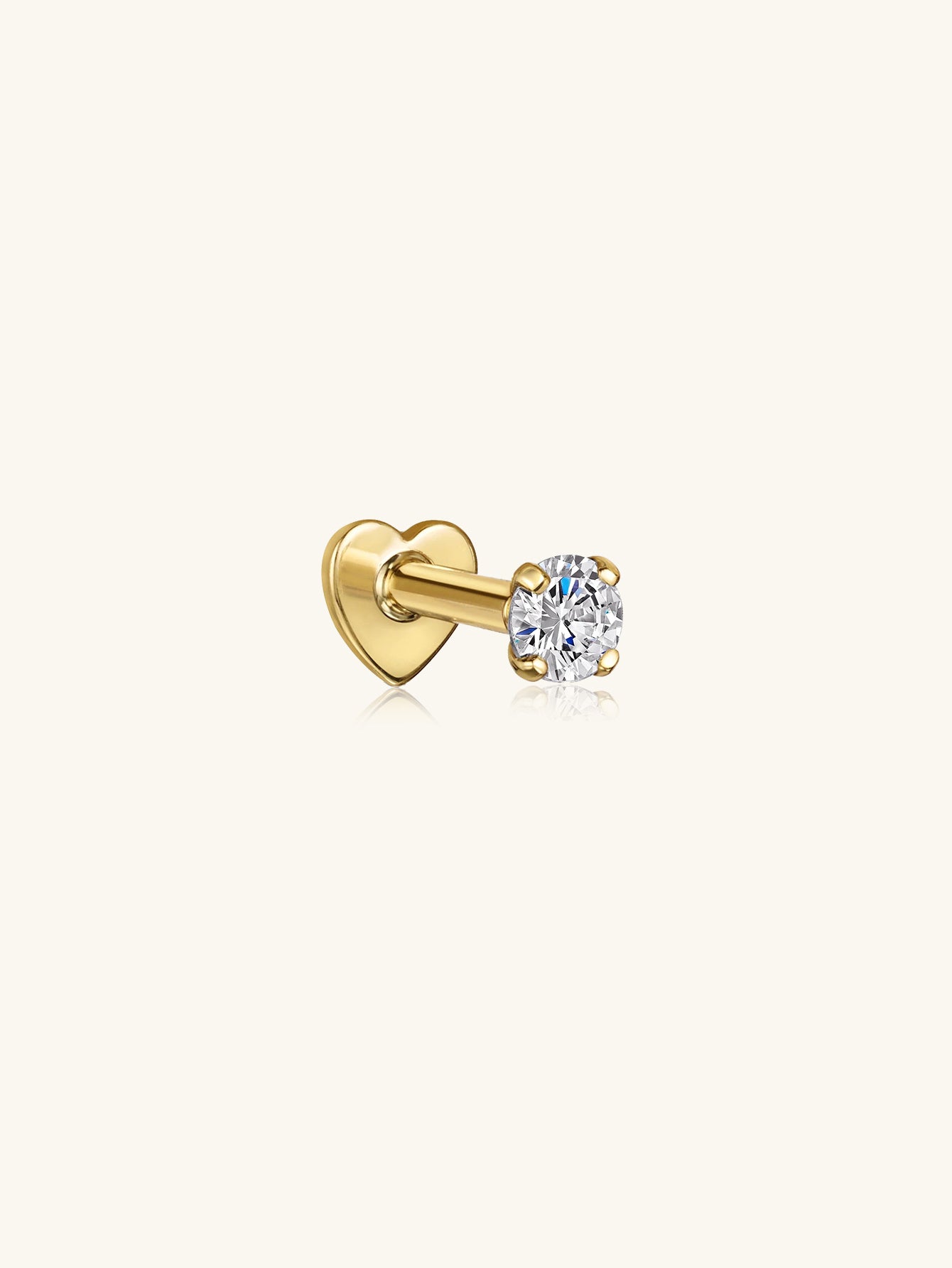 Gold plated 925 sterling silver labret stud with heart backing and round cubic zirconia solitaire.
