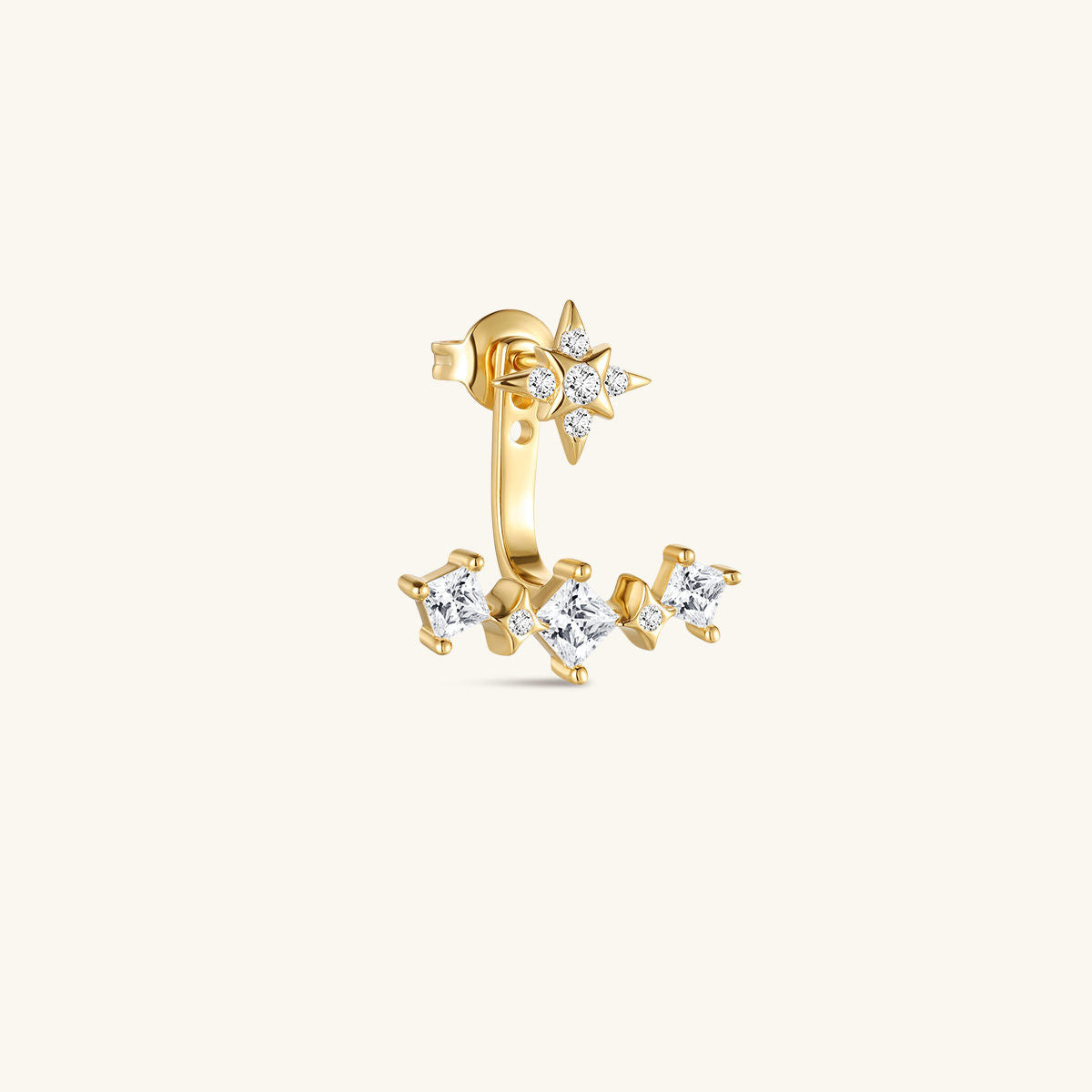 Close-up of KOSINER Rising Star gold-plated star stud and curved ear jacket styled with celestial earrings