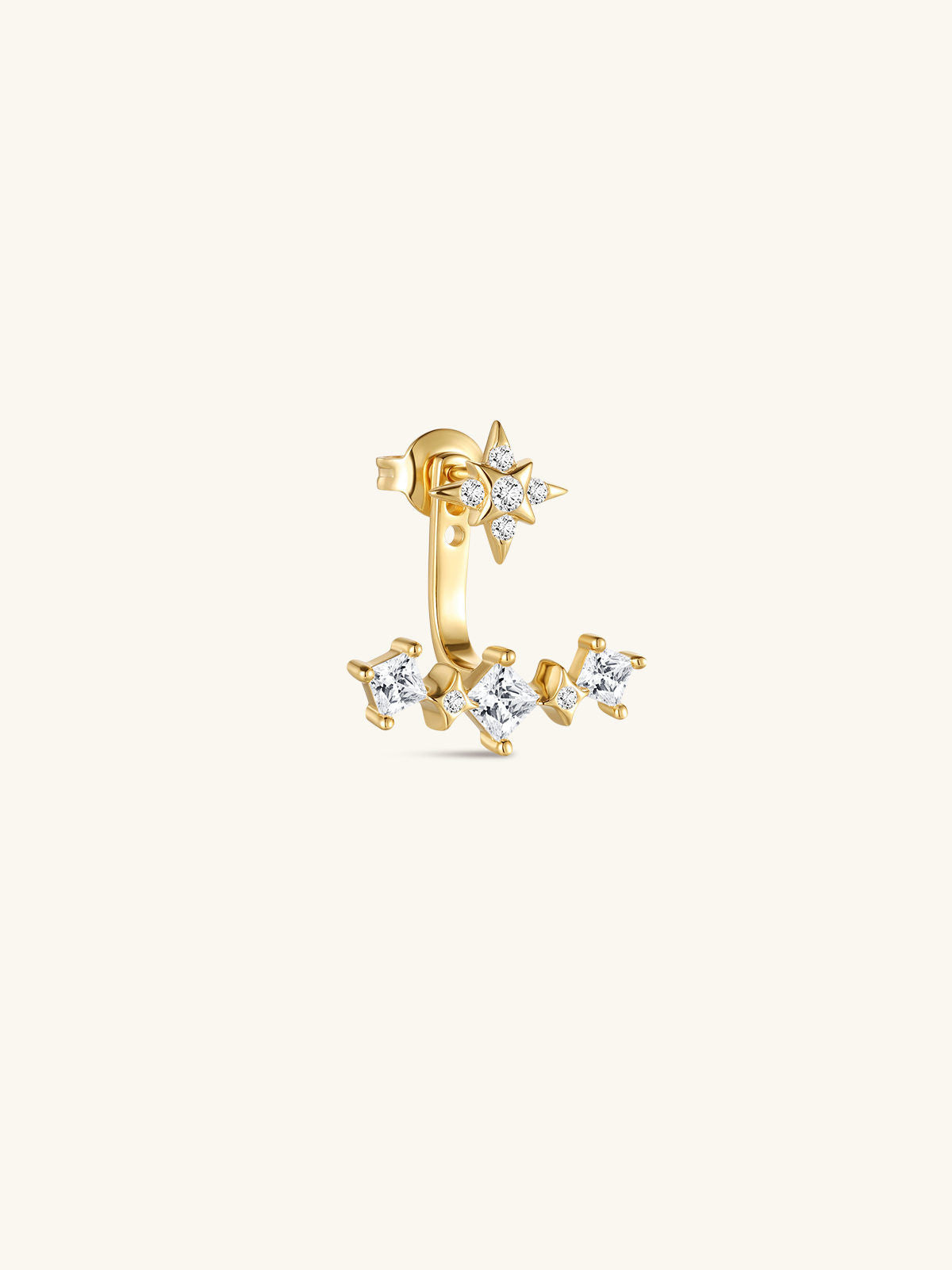 Close-up of KOSINER Rising Star gold-plated star stud and curved ear jacket styled with celestial earrings