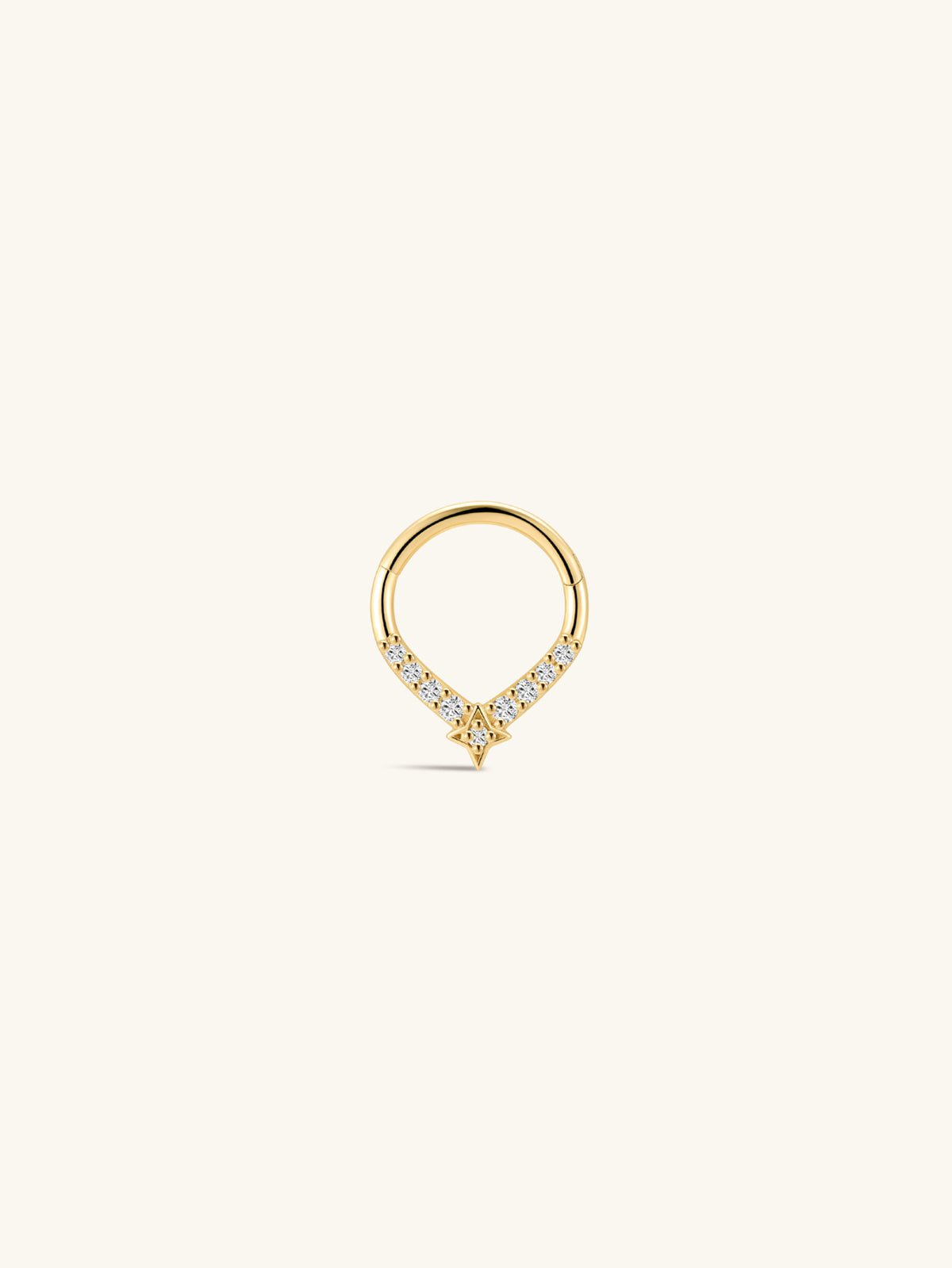 KOSINER Starlight four-point star teardrop daith clicker hoop on plain white background, smooth 14K gold teardrop silhouette, row of round pavé CZ gemstones, dangling four-point star accent with center crystal, secure hinged clicker construction for easy daith insertion