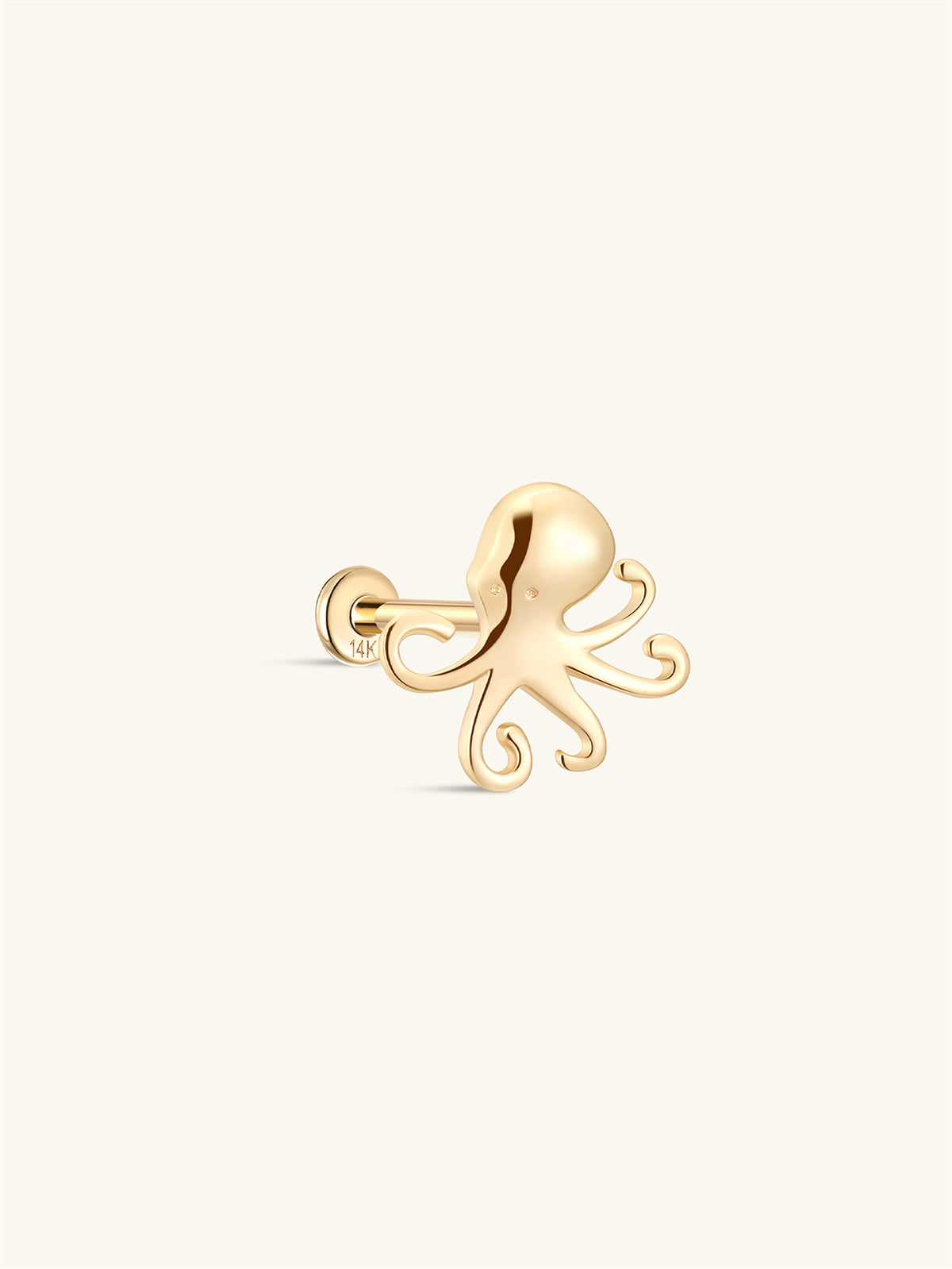 Side profile shot of KOSINER 14K solid gold octopus flat back stud, internally threaded post marked with 14K stamp, polished 3D octopus silhouette with curved tentacle detailing, cute marine animal cartilage piercing stud