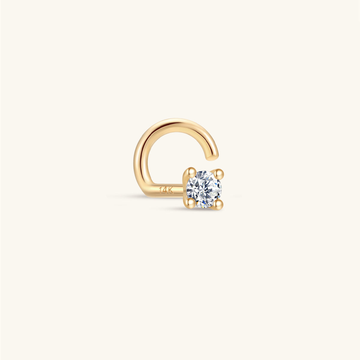Single KOSINER 14K solid gold twist hook nose stud, four-prong set round clear stone, engraved 14K marking on curved post, isolated on plain white background