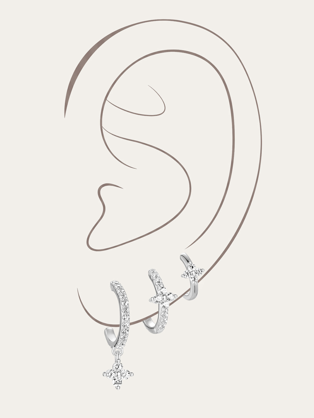 Kosiner 3-piece sterling silver hoop earring set with floral Zircon stones, one featuring a dangling charm.