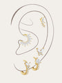 18k gold plated sterling silver earring set with butterfly & leaf CZ designs on ear.