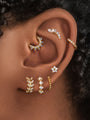 Gold 16g cartilage hoop earrings featuring leaf, floral and beaded designs with cubic zirconia.