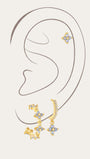 Set of 3 gold-plated sterling silver earrings with light blue floral cubic zirconia stones and micro-paved crystals.