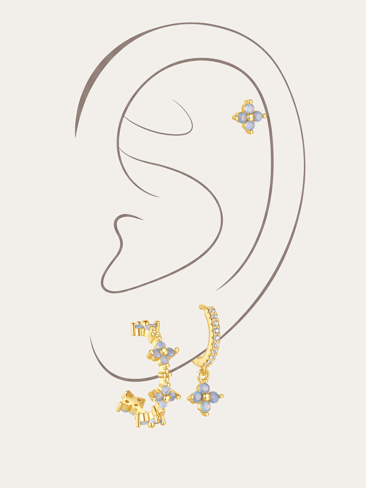 Set of 3 gold-plated sterling silver earrings with light blue floral cubic zirconia stones and micro-paved crystals.