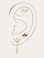 Gold plated sterling silver Red Flaming Wings pendant earrings with red & clear cubic zirconia, styled on ear.