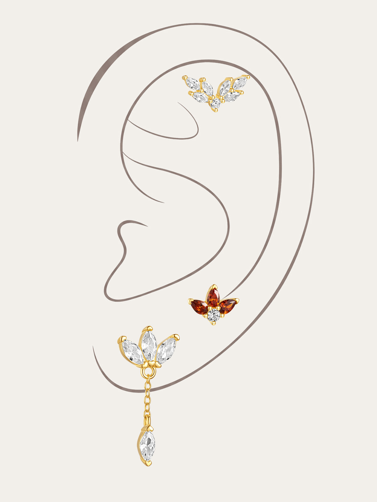 Gold plated sterling silver Red Flaming Wings pendant earrings with red & clear cubic zirconia, styled on ear.