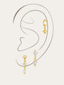 Gold plated 925 sterling silver earrings featuring marquise, displayed on an ear.