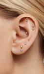 KOSINER 14K gold drop flat back stud worn in multiple ear piercings, helix lobe tragus curated ear stack with dangle CZ piercing earrings