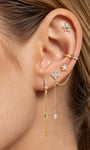 KOSINER Rising Star gold-plated star chain hoop on a cream display showing its hinged closure and draped chain loop