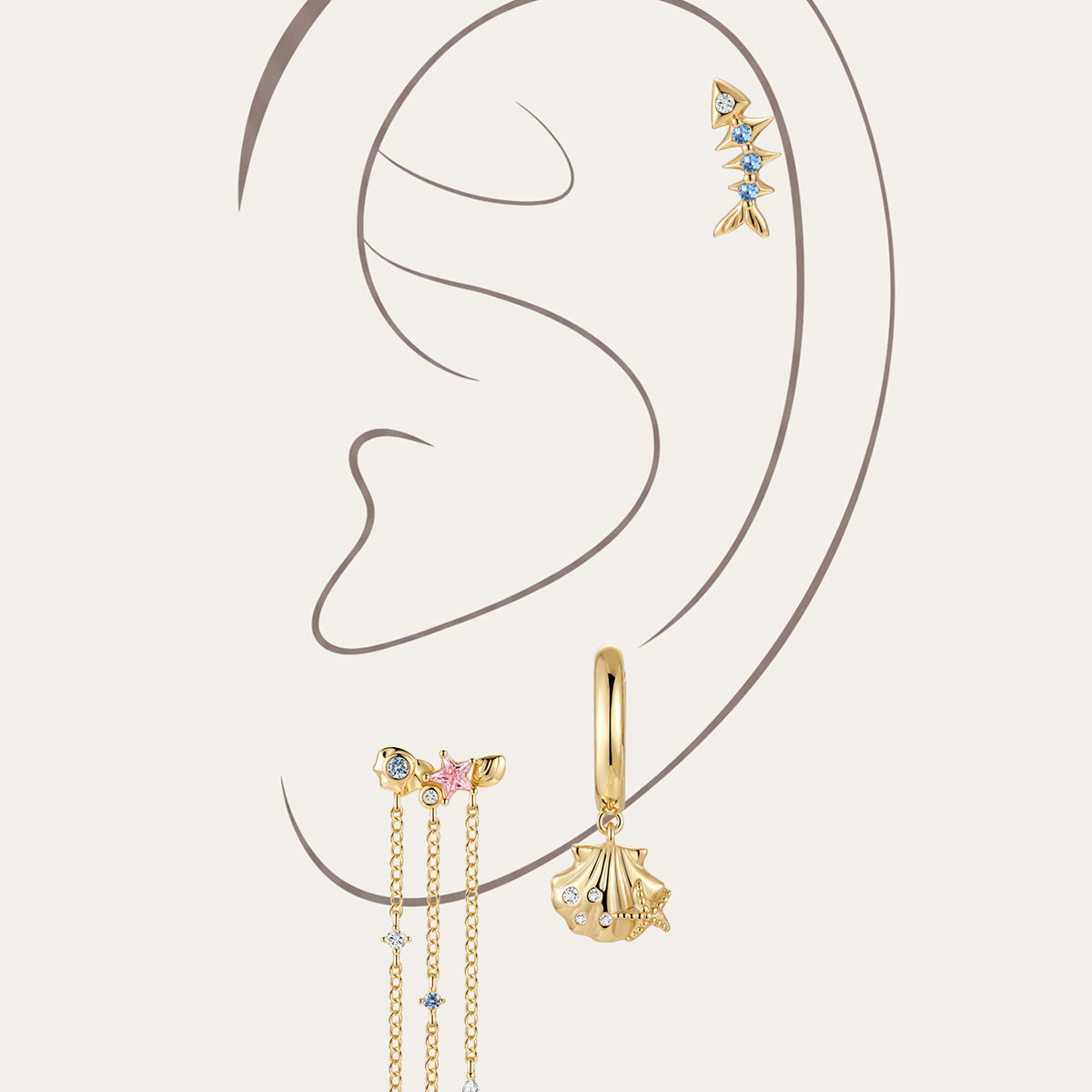 KOSINER 925 sterling silver gold oceanic drop earrings set, presented on a minimalist ear outline illustration, including fish bone cartilage stud, shell charm hoop earring and starfish tassel dangle earring with blue, pink and clear cubic zirconia stones