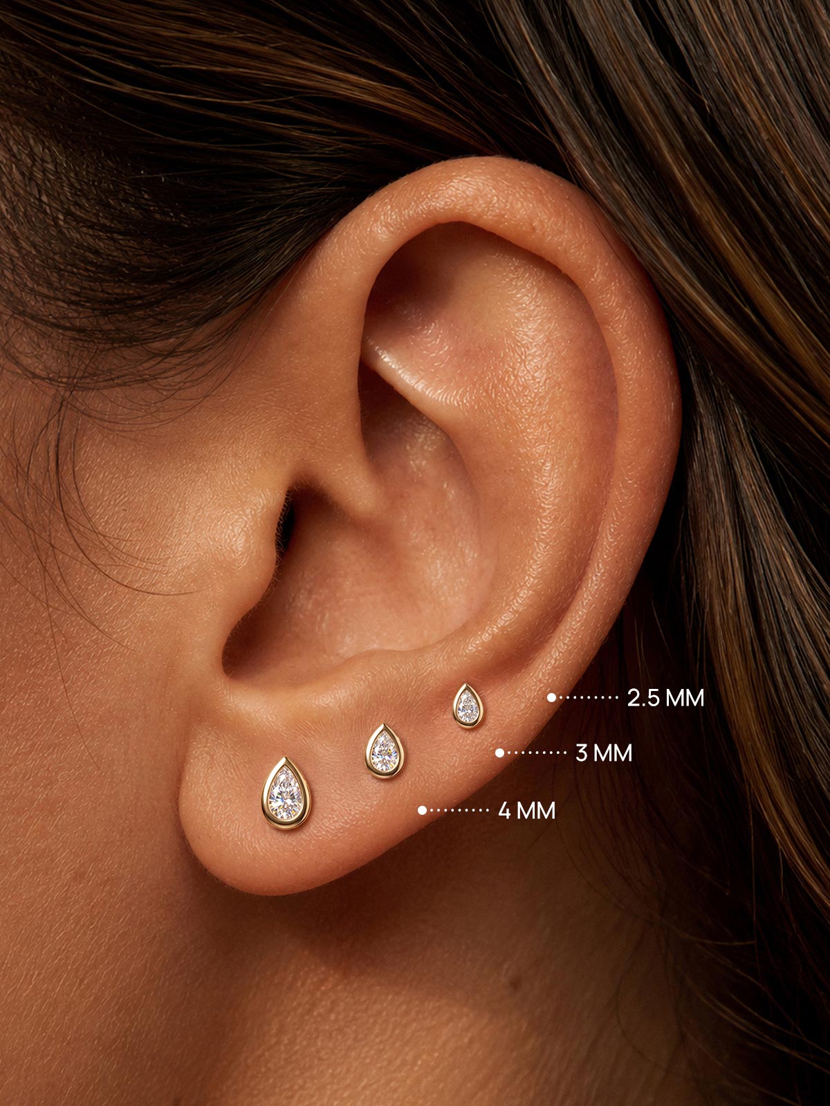 KOSINER pear lab-grown diamond flat back studs in 2.5mm, 3mm and 4mm sizes on ear