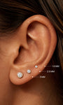 KOSINER round bezel lab-grown diamond flat back studs in 1.6mm, 2.5mm and 3mm sizes on ear