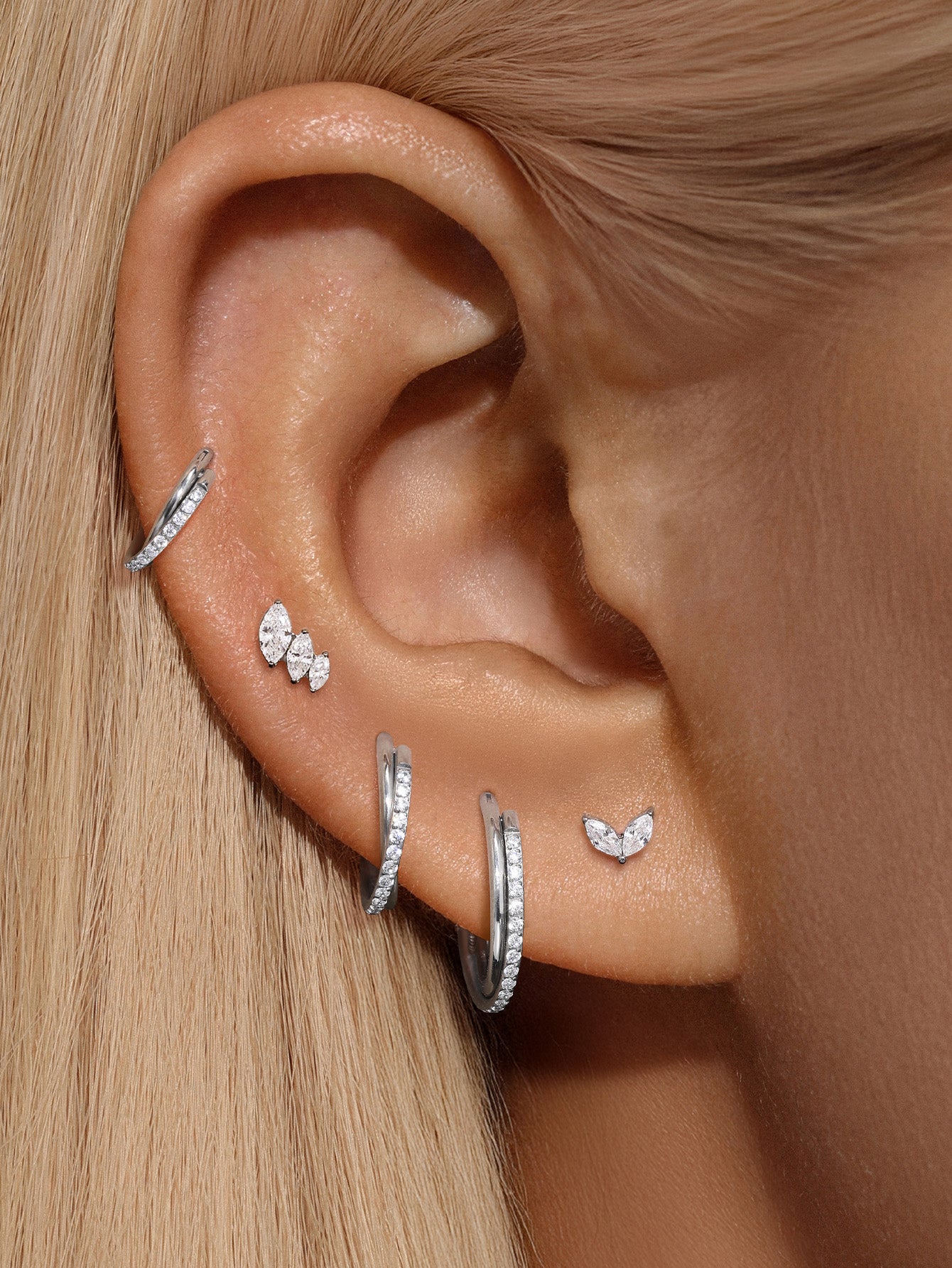 Huggies con pavé de garras de titanio