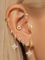 All-match gold plated 925 sterling silver piercing earrings with cubic zirconia, showcasing versatile designs on an ear.