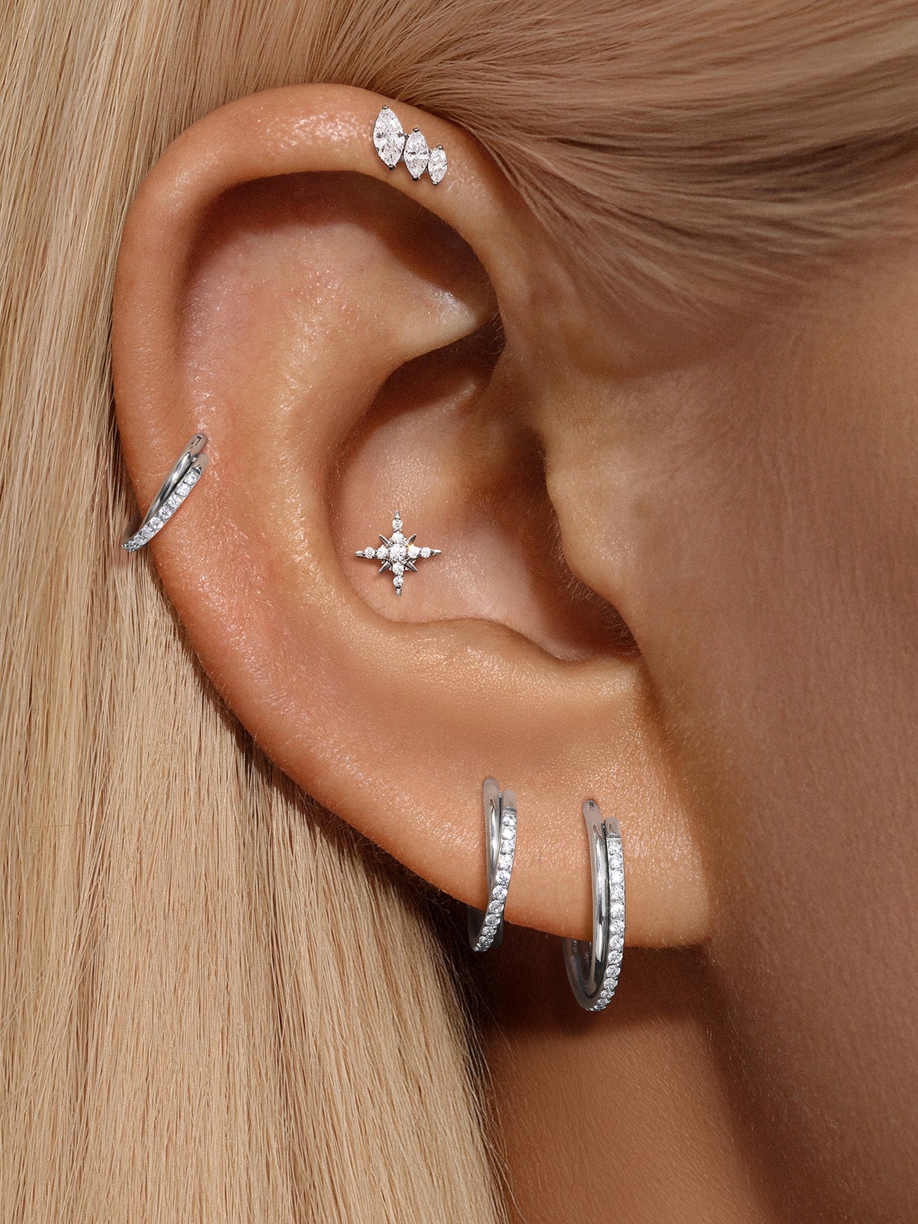 Huggies con pavé de garras de titanio