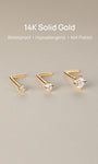 Three sizes of KOSINER 14K solid gold L-shape nose studs arranged on soft neutral backdrop, text overlay: 14K Solid Gold, Waterproof, Hypoallergenic, Not Plated premium body piercing jewelry