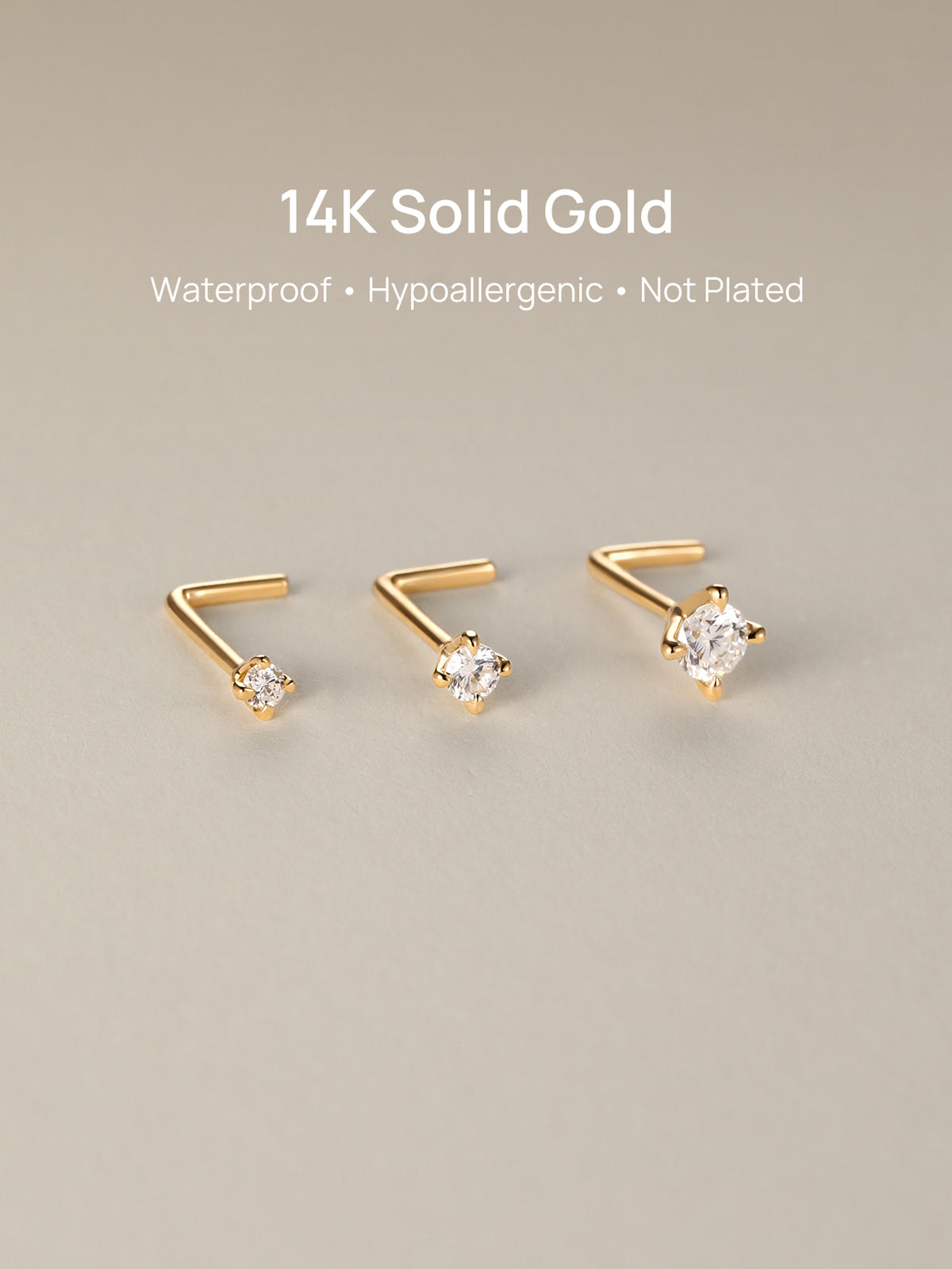Three sizes of KOSINER 14K solid gold L-shape nose studs arranged on soft neutral backdrop, text overlay: 14K Solid Gold, Waterproof, Hypoallergenic, Not Plated premium body piercing jewelry