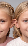 Two models wearing Little Wonder 14K gold flat back studs in curated ear stacks