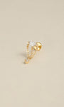 Angled still‑life shot of 14K solid gold multi‑chain tassel CZ dangle flat back labret stud on soft beige background