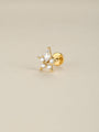 KOSINER Rising Star gold-plated Hollow Star flat back stud worn on the upper helix in a celestial ear stack