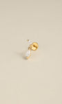 Angled still‑life shot of 14K solid gold double marquise CZ dangle flat back labret stud on soft beige background
