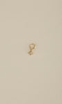 14K solid gold eight-point north star dangle charm with cubic zirconia, KOSINER detachable piercing ear charm on neutral beige background