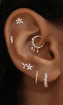Ear stacking look with assorted KOSINER 14K solid gold flower cartilage piercing studs, multi-position helix lobe layered ear jewelry styling