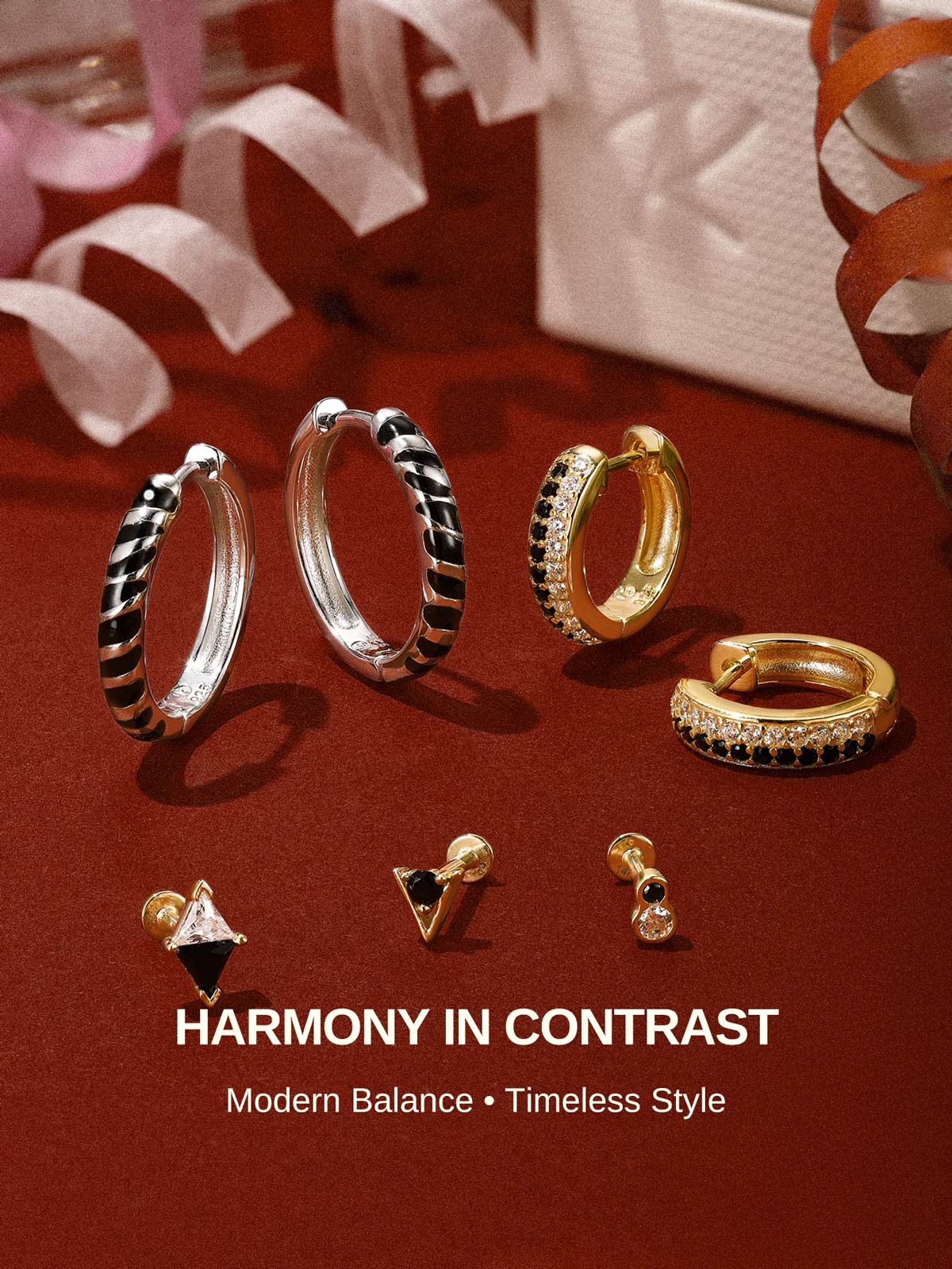 KOSINER Puzzle collection jewelry lineup on burgundy backdrop, two-tone bezel flat back studs, geometric triangle studs, zebra stripe hoops, staggered pave hoop earrings, slogan Harmony In Contrast, modern black & white contrast fashion piercing jewelry collection
