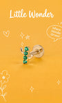 Little Wonder 14K solid gold cactus flat back stud on an orange background