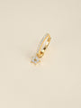 KOSINER Rising Star gold-plated star dangle hoop worn in the first lobe piercing with matching celestial studs